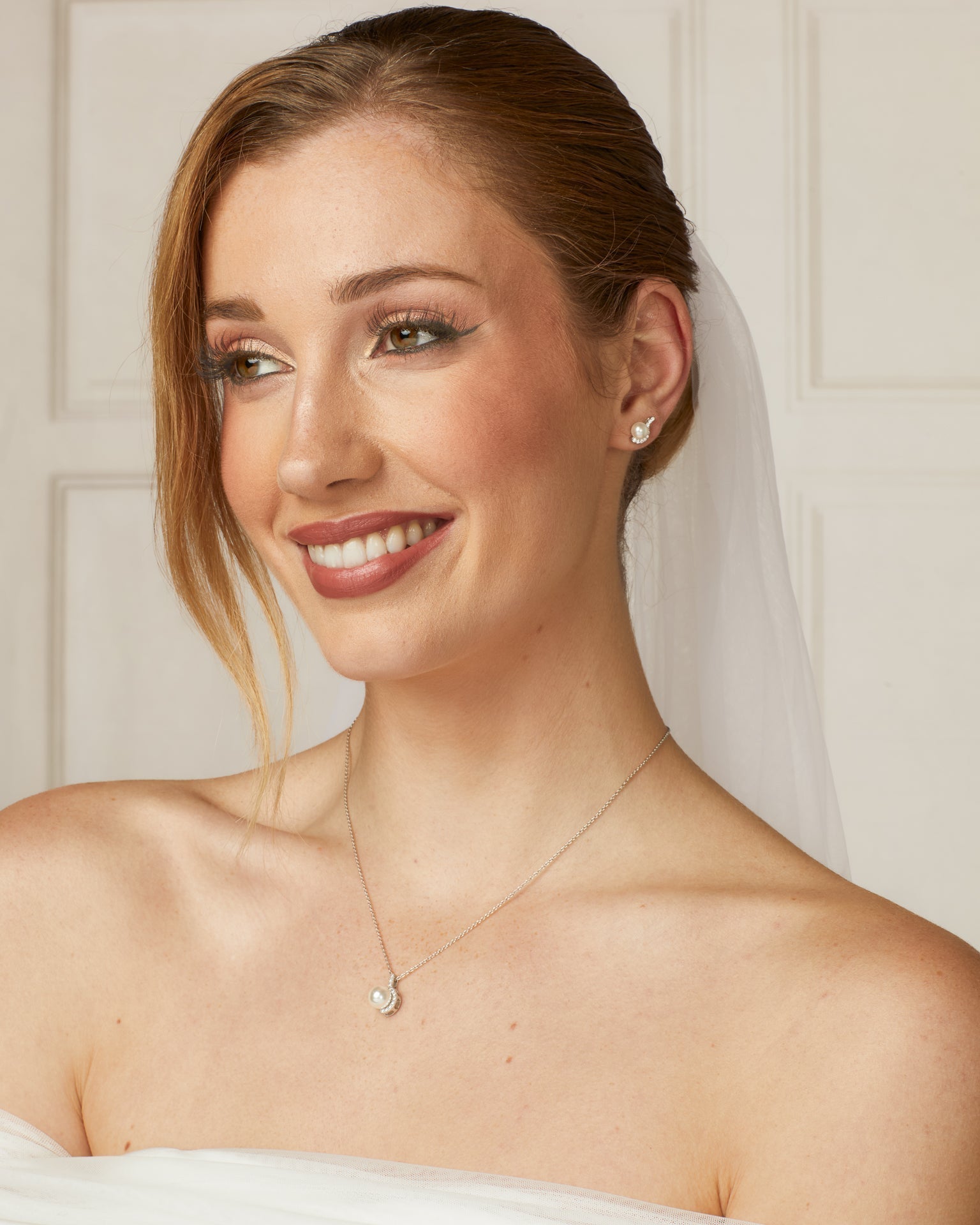 Diamonfire pearl bridal jewellery, matching pearl and zirconia half halo neckla and stud earrings